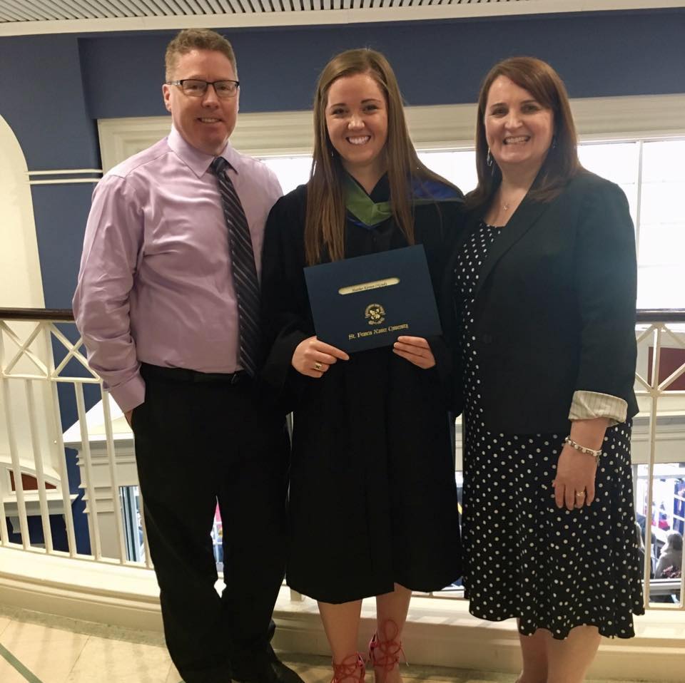 Dr. Heather O'Grady Heather at StFX Convocation in 2017 with her parents
