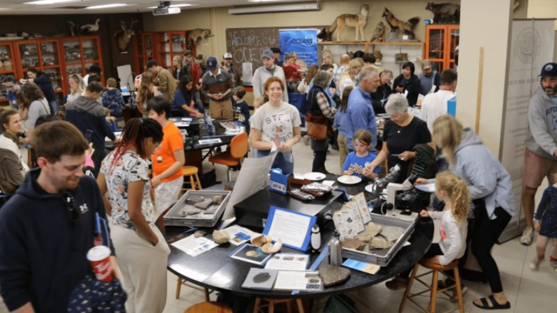 People gathered around tables during World Oceans Day 