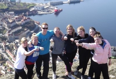 A group of people standing on top of a mountain
