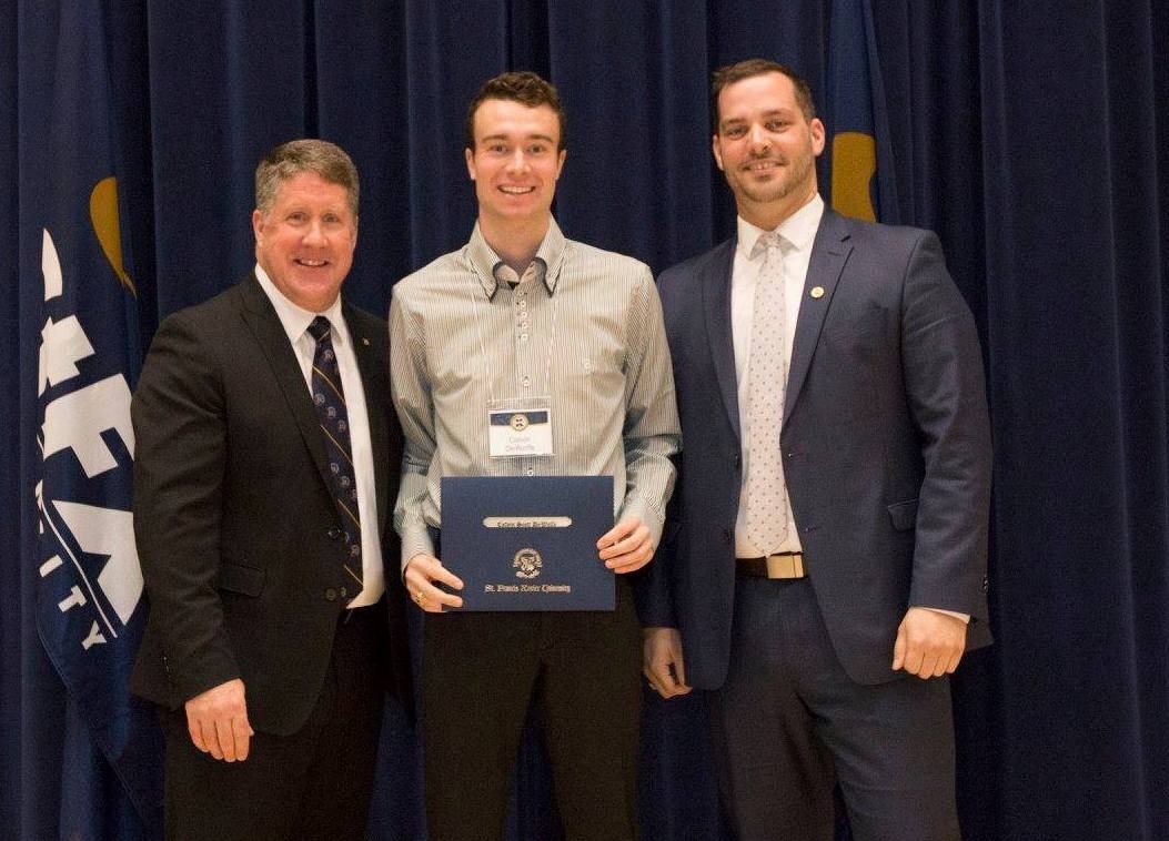 Calvin DeWolfe receives his certificate