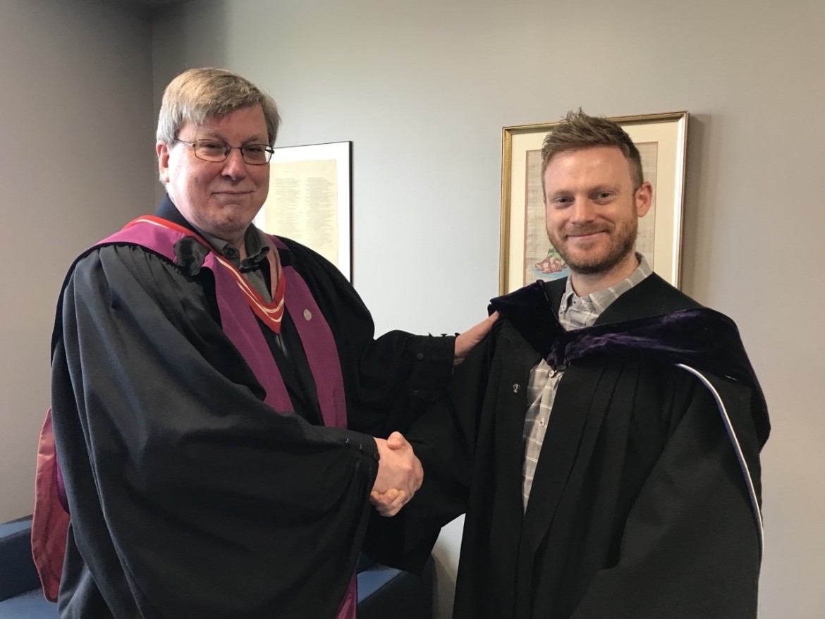Dr. Richard Neels receiving his Owl Pin from Dr. Will Sweet