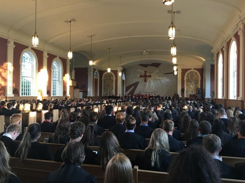 The inside of a church with people in the pews