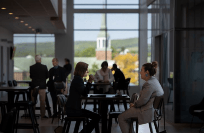 People sitting at a table in Mulroney Hall