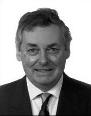 Headshot of a man wearing a suit