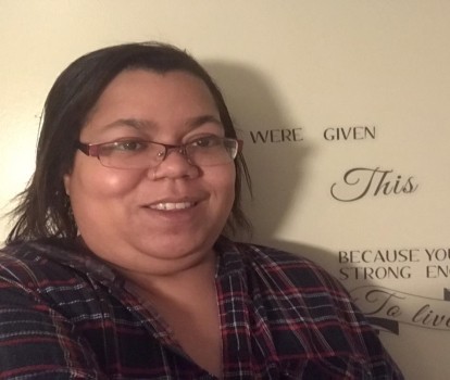 Portrait of person with glasses smiling