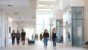 Students walking through the second floor of Mulroney Hall.